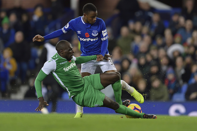 Everton FC forward Ademola Lookman (standing) is tackled by Gor Mahia FC's defender Joash Onyango during their SportPesa Trophy match at Goodison Park on November 6, 2018. PHOTO/Everton FC