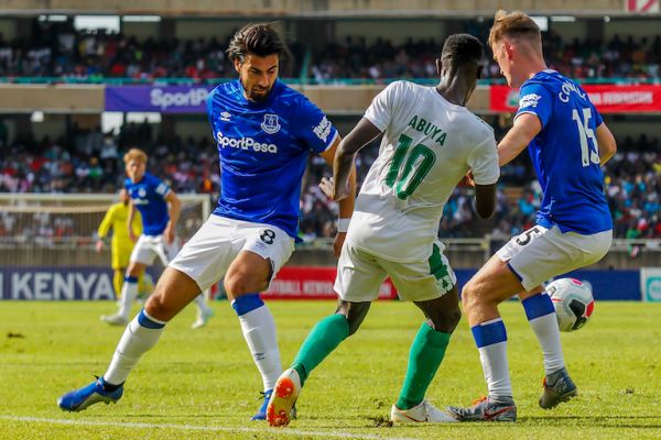Everton FC players Andre Gomes (left) and Callum Conolly (right) wrest the ball from Kariobangi Sharks FC forward, Duke Abuya during their landmark friendly at the MISC Kasarani on Sunday, July 19, 2019. PHOTO/SPN 