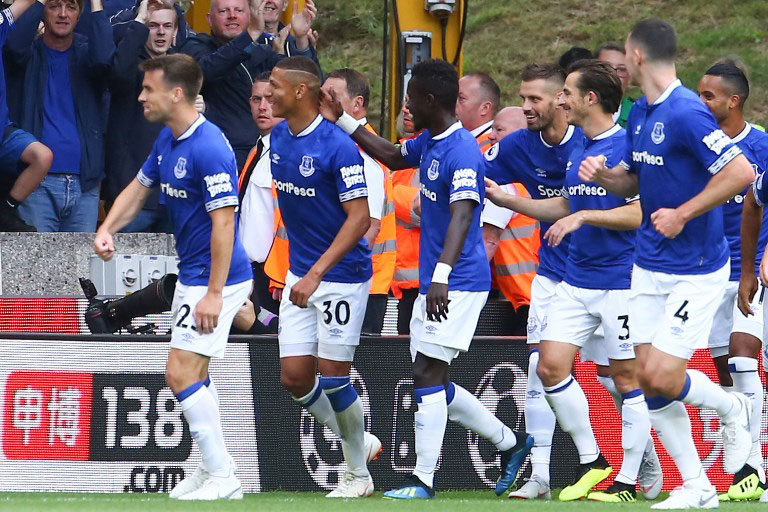 Everton FC players celebrate the opening goal from Brazilian Richarlison (2nd left) in their English Premier League clash against Wolverhampton Wanderers FC at the Molineux on August 11, 2018. PHOTO/AFP