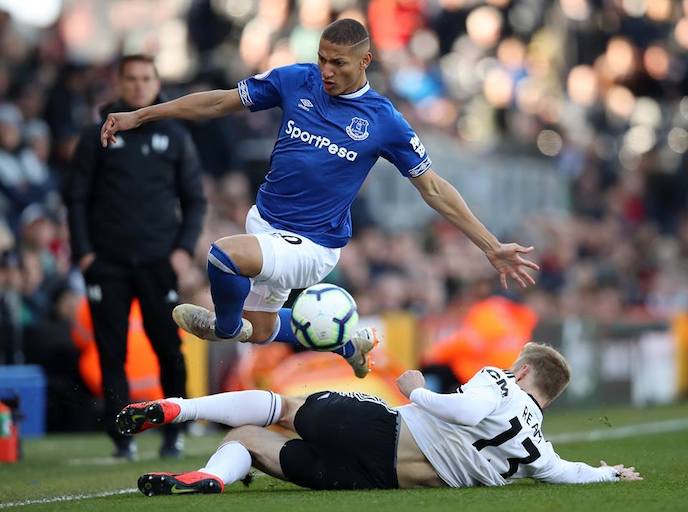 Everton FC striker, Richarlison jumps over the challenger of Fulham FC's Tim Ream during their English Premier League clash at Craven Cottage on Saturday, April 13, 2019. PHOTO/Everton FC
