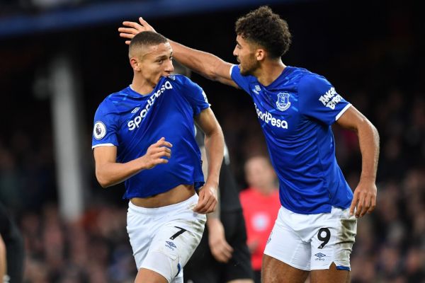 Everton's Brazilian striker Richarlison (L) celebrates with Everton's English striker Dominic Calvert-Lewin (R) after scoring the opening goal of the English Premier League football match between Everton and Brighton Hove and Albion at Goodison Park in Liverpool, north west England on January 11, 2020. PHOTO | AFP