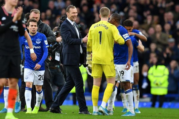 Everton's caretaker manager Duncan Ferguson (C) congratulates his players on the pitch after the English Premier League football match between Everton and Chelsea at Goodison Park in Liverpool, north west England on December 7, 2019. Everton won the game 3-1. PHOTO | AFP