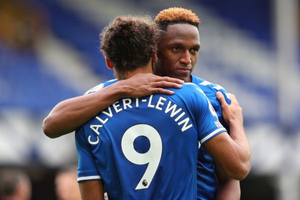 Everton's English striker Dominic Calvert-Lewin (L) and Everton's Colombian defender Yerry Mina react at the final whistle during the English Premier League football match between Everton and Liverpool at Goodison Park in Liverpool, north west England on October 17, 2020. PHOTO | AFP