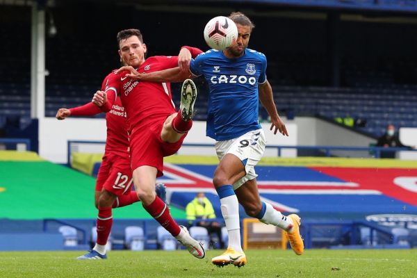 Everton's English striker Dominic Calvert-Lewin (R) vies with Liverpool's Scottish defender Andrew Robertson during the English Premier League football match between Everton and Liverpool at Goodison Park in Liverpool, north west England on October 17, 2020. PHOTO | AFP