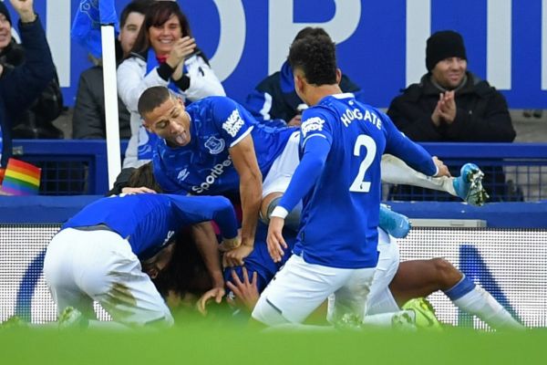 Everton's English striker Dominic Calvert-Lewin celebrates with teammates after scoring their second goal during the English Premier League football match between Everton and Chelsea at Goodison Park in Liverpool, north west England on December 7, 2019. PHOTO | AFP