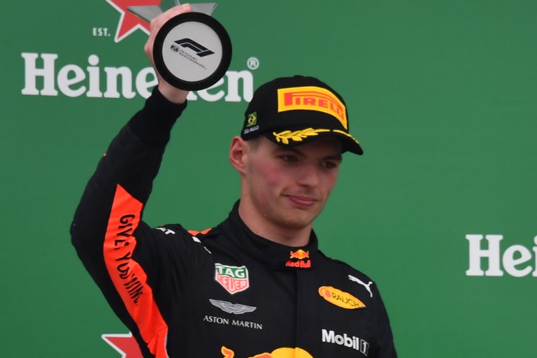 F1 Brazil Grand Prix runner-up Red Bull's Dutch driver Max Verstappen displays his trophy in the podium at the Interlagos racetrack in Sao Paulo, Brazil on November 11, 2018. PHOTO/AFP