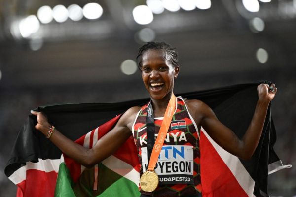 Faith Kipyegon celebrates after winning her first world 5000m crown. PHOTO| AFP