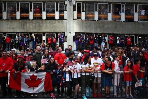 Fans cheer during the Toronto Raptors Victory Parade on June 17, 2019 in Toronto, Canada. The Toronto Raptors beat the Golden State Warriors 4-2 to win the 2019 NBA Finals. PHOTO | AFP