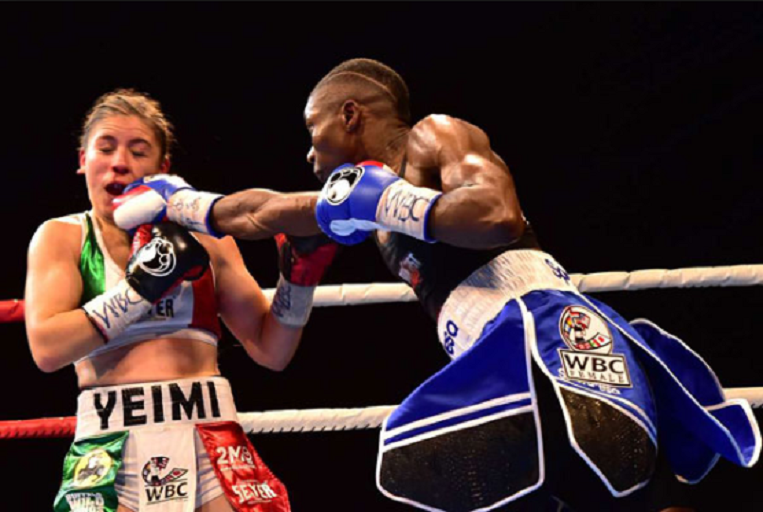 Fatuma Zarika punches Yamileth Mercado on her way to defend the WBC Super Bantamweight title in Nairobi on September 8. PHOTO/Nation
