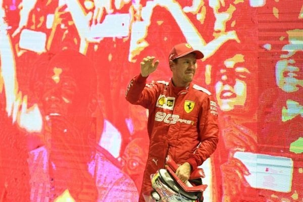 Ferrari's German driver Sebastian Vettel celebrates his victory at the end of the Formula One Singapore Grand Prix night race at the Marina Bay Street Circuit in Singapore on September 22, 2019. PHOTO | AFP