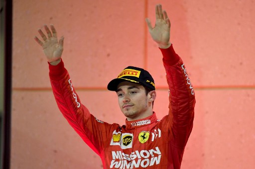 Ferrari's Monegasque driver Charles Leclerc celebrates on the podium after placing third at the Formula One Bahrain Grand Prix at the Sakhir circuit in the desert south of the Bahraini capital Manama. PHOTO/AFP