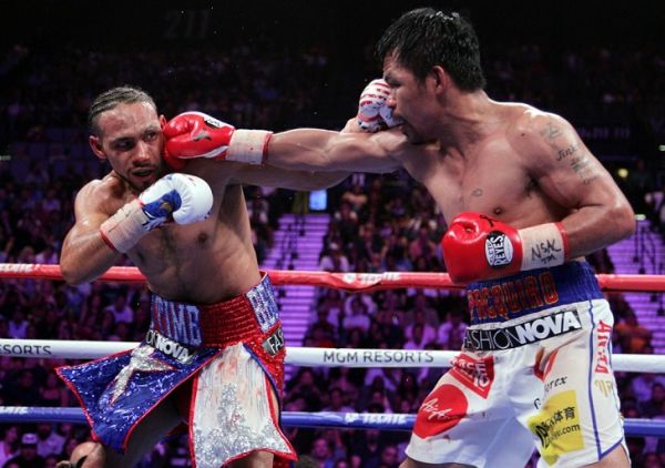 Filipino boxer Manny Pacquiao (R) connects with a right to the face of US boxer Keith Thurman during their WBA super world welterweight title fight at the MGM Grand Garden Arena on July 20, 2019 in Las Vegas, Nevada. Pacquiao won a 12 round split decision. PHOTO | AFP