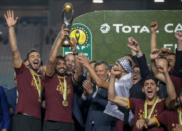 Football players of Esperance celebrate the championship title after football players of Wydad Casablanca abandoned the field during the CAF (Confederation of African Football) Champions league final match between Esperance and Wydad Casablanca at Stade Olympique de Rades in Rades, Tunisia on June 1, 2019. PHOTO/AFP