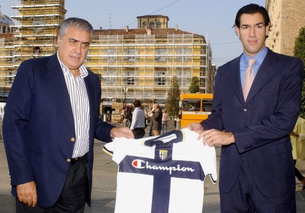Former Real Madrid president Lorenzo Sanz (L) shows a Parma's jersey as he poses with his son Lorenzo jr 23 September 2005. Sanz has moved a step closer to becoming the first non-Italian owner of a Serie A club after paid 7.5 million euros ($9.1 million) for the acquisition of the Italian Parma Football Club. Parma have been in search of a buyer since the collapse of their parent company Parmalat in December 2003. PHOTO | AFP