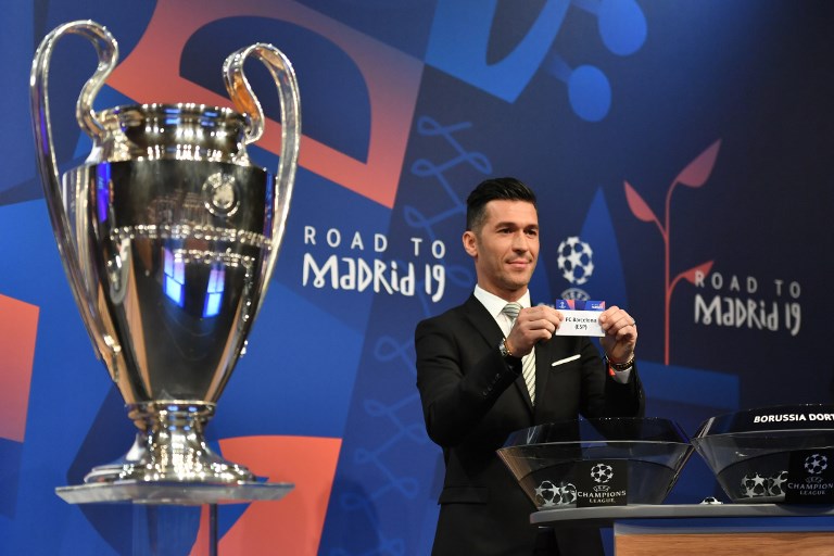 Former Spanish football player Luis Garcia shows the slip of FC Barcelona next to the cup, during the draw for the round of 16 of the UEFA Champions League football tournament at the UEFA headquarters in Nyon on December 17, 2018. PHOTO/AFP