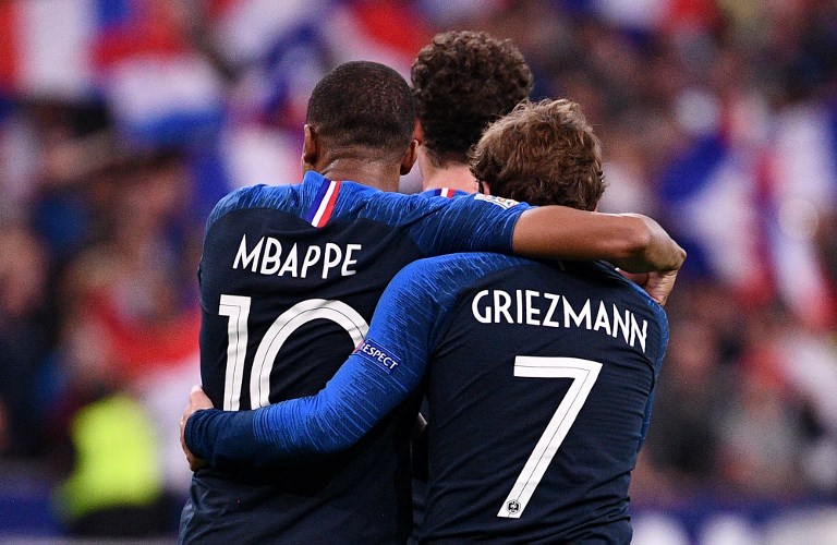 France's forward Antoine Griezmann (R) is congratuled by France's forward Kylian Mbappe after scoring a goal during the UEFA Nations League football match between France and Germany at the Stade de France in Saint-Denis, near Paris on October 16, 2018. PHOTO/AFP