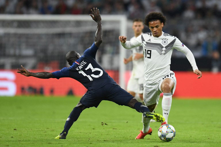 France's midfielder N'Golo Kante (L) and Germany's midfielder Leroy Sane vie for the ball during the UEFA Nations League football match Germany against France on September 6, 2018 in Munich, southern Germany. PHOTO/AFP