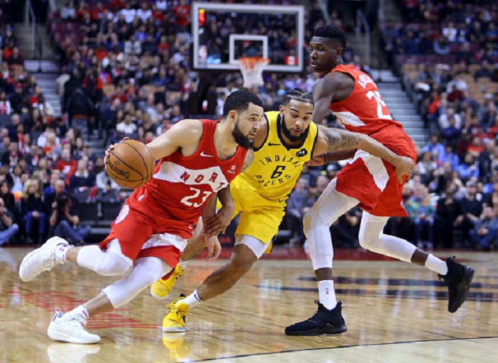 Fred VanVleet #23 of the Toronto Raptors dribbles the ball as Cory Joseph #6 of the Indiana Pacers defends during the second half of an NBA game at Scotiabank Arena on January 6, 2019 in Toronto, Canada. PHOTO/GettyImages