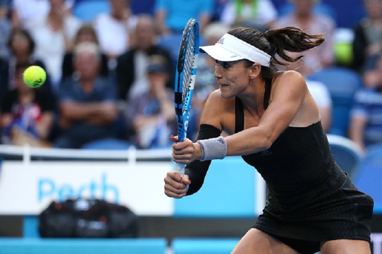 Garbine Muguruza of Spain plays a backhand to Ash Barty of Australia during day five of the 2019 Hopman Cup at RAC Arena on January 02, 2019 in Perth, Australia. PHOTO/GettyImages