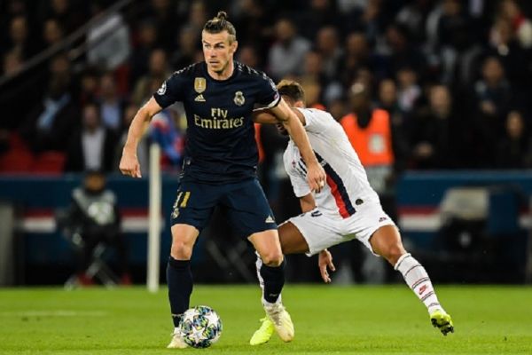 Gareth Frank Bale of Real Madrid CF, Juan Bernat of Paris Saint-Germain during the UEFA Champions League group A match between Paris St Germain and Real Madrid at at the Parc des Princes on September 18, 2019 in Paris, France. PHOTO/ GETTY IMAGES