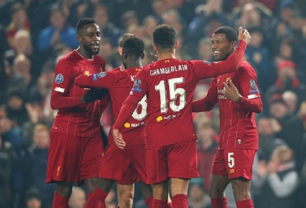 Georginio Wijnaldum of Liverpool FC celebrates with team mates after scoring the opening goal during the UEFA Champions League group E match between Liverpool FC and KRC Genk at Anfield on November 05, 2019 in Liverpool, United Kingdom.PHOTO/ GETTY IMAGES