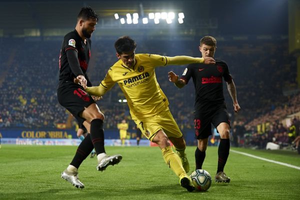 Gerard Moreno of Villarreal and Felipe Monteiro and Kieran Trippier of Atletico Madrid competes for the ball during the Liga match between Villarreal CF and Club Atletico de Madrid at Estadio de la Ceramica on December 6, 2019 in Villareal, Spain. PHOTO | AFP