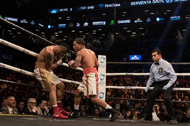 Gervonta Davis ( white with red stripe trunks) defeats Jesue Cuellar ( whote and gold trunks) by 3rd round knockout in their WBA Super Featherweight fight at Barclays Center on April 21, 2018 in New York City.PHOTO/GETTY IMAGES