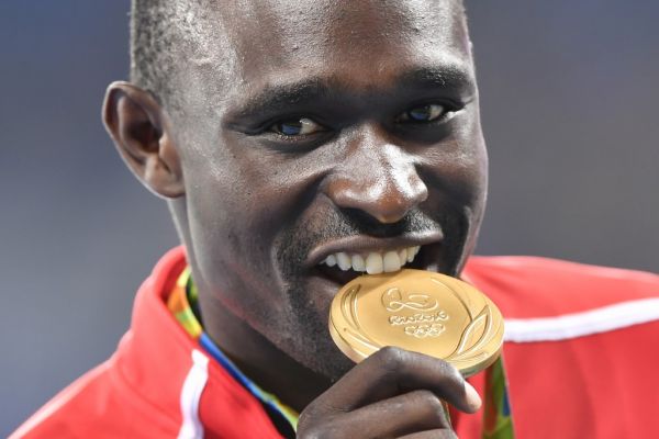 Gold medallist Kenya's David Lekuta Rudisha celebrates on the podium for the Men's 800 meter during the athletics at the Rio 2016 Olympic Games at the Olympic Stadium in Rio de Janeiro on August 16, 2016. PHOTO | AFP