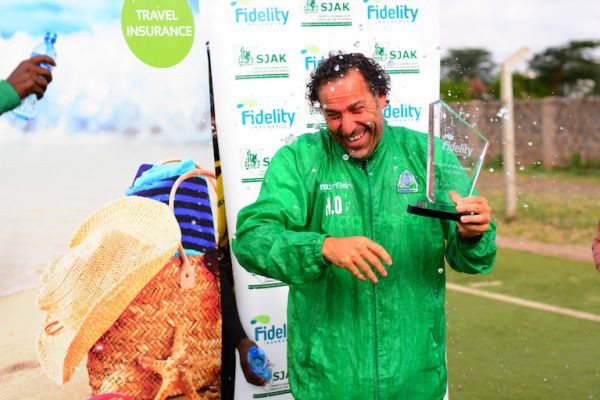 Gor Mahia FC head coach, Hassan Oktay, is splashed with water when receiving his plaque as the Fidelity Coach of the Month for April winner at Camp Toyoyo Grounds, Nairobi on May 23, 2019. PHOTO/Courtesy