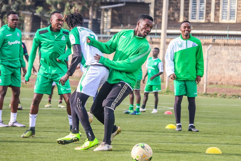 Gor Mahia FC left back, Shafik Batambuze ( with dreadlocks) tussle for the ball at the team’s training at Camp Toyoyo Grounds in Nairobi on Wednesday October 31, 2018.PHOTO:SPN