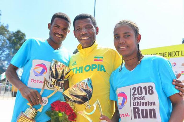 Great Ethiopian Run winners Hagos Gebrhiwet and Fotyen Tesfaye with Haile Gebrselassie. PHOTO/IAAF