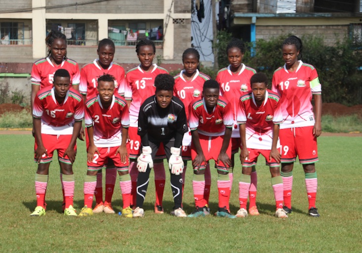 Harambee Starlets players pose for a team photo prior to their friendly match against the National U15 boys team at the Utalii Sports Grounds. PHOTO/Courtesy/FKF