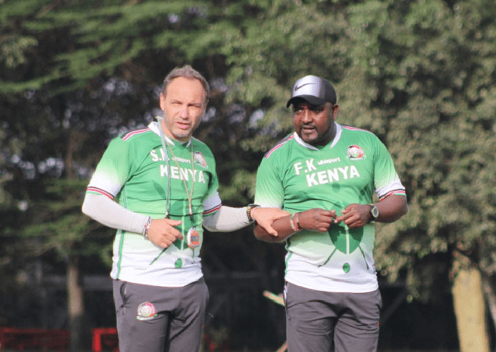 Harambee Stars coach Sébastien Migné in consultation with his assistant Francis Kimanzi during the team's second training session on Tuesday September 4, 2018, at the Kenya School of Monetary Studies grounds. PHOTO/Courtesy/FKF