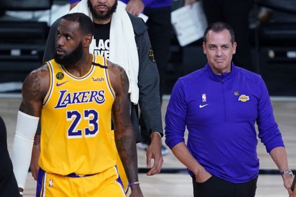 Head coach Frank Vogel and LeBron James #23 of the Los Angeles Lakers walk on the court during a timeout due to a goal being knocked out of position during action against the Portland Trail Blazers in the first half in Game 1 of Round 1 of the NBA Playoffs at AdventHealth Arena at ESPN Wide World Of Sports Complex on August 18, 2020 in Lake Buena Vista, Florida. PHOTO | AFP