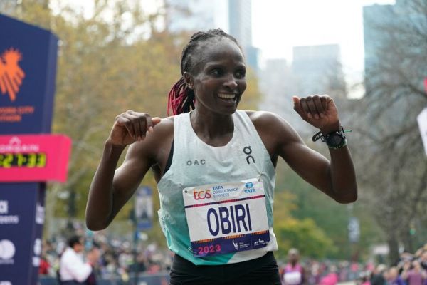 Hellen Obiri celebrates after winning the 2023New York City Marathon . PHOTO| AFP