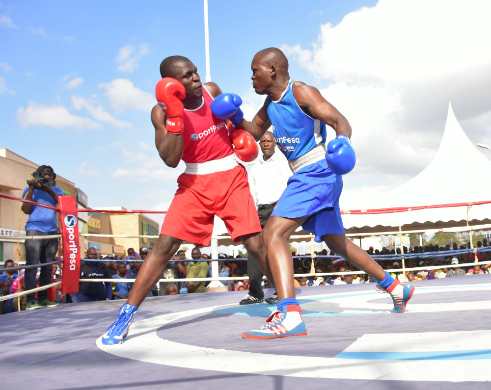 Hit Squad captain Nick Abaka (in red) slugging for Kenya Defence Forces in a past Boxing Association of Kenya League. PHOTO/SPN