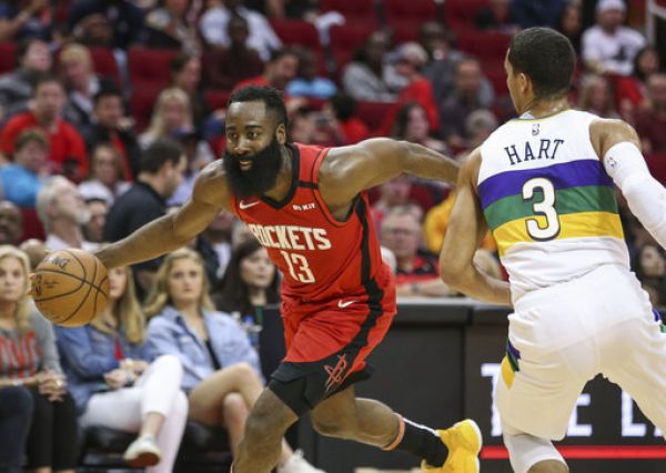 Houston Rockets guard James Harden (13) drives with the ball as New Orleans Pelicans guard Josh Hart (3) defends during the second quarter at Toyota Center. PHOTO | PA Images