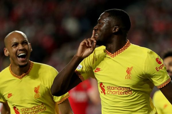 Ibrahima Konate of Liverpool FC (R ) celebrates after scoring a goal during the UEFA Champions League Quarter Final Leg One football match between SL Benfica and Liverpool FC at the Luz stadium in Lisbon, Portugal on April 5, 2022. PHOTO | AFP