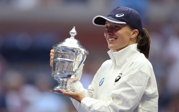 Iga Swiatek of Poland celebrates with the championship trophy after defeating Ons Jabeur of Tunisia during their Women’s Singles Final match on Day Thirteen of the 2022 US Open at USTA Billie Jean King National Tennis Center on September 10, 2022 in the Flushing neighborhood of the Queens borough of New York City. PHOTO | AFP