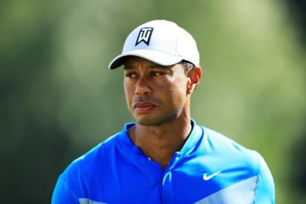 iger Woods of the United States walks from the 18th green during the first round of the BMW Championship at Medinah Country Club No. 3 on August 15, 2019 in Medinah, Illinois.PHOTO/ AFP