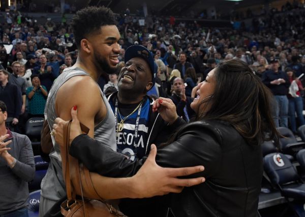 In this file photo taken on April 10, 2018 Karl-Anthony Towns #32 of the Minnesota Timberwolves hugs his parents, Karl and Jackie Towns after winning the game against the Denver Nuggets at the Target Center in Minneapolis, Minnesota. The Timberwolves defeated the Nuggets 112-106. Jacqueline Towns, mother of Minnesota Timberwolves center Karl-Anthony Towns, died April 13, 2020 of complications of the coronavirus, the NBA team announced. PHOTO | AFP