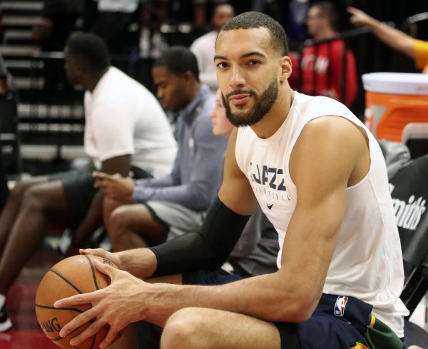 In this file photo taken on December 04, 2019 Utah Jazz center Rudy Gobert cools down after warm ups before a NBA game against Los Angeles Lakers in Salt Lake City, Utah. The NBA will suspend play starting on Thursday after a Utah Jazz player preliminarily tested positive for the new coronavirus, the league said March 11, 2020. The test result was reported shortly before Utah's game against the Thunder in Oklahoma City was to begin, and that game was abruptly postponed. The NBA did not name the player who had tested positive, but several US media outlets reported it was French defensive standout Rudy Gobert, who was listed first as questionable for the game and then as out with illness. PHOTO | AFP