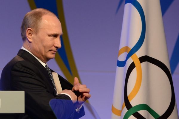 In this file photo taken on February 06, 2014 Russian President Vladimir Putin leaves the stage after delivering his speech at the International Olympic Committee (IOC) Gala Dinner in Sochi, on the eve of the Sochi 2014 Olympic Winter Games opening ceremony. Russia will miss next year's Tokyo Olympics and the 2022 Beijing Winter Games after the World Anti-Doping Agency on Monday banned the powerhouse from global sporting events for four years over manipulated doping data. PHOTO | AFP