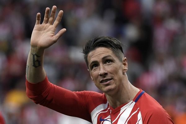 In this file photo taken on May 20, 2018 Atletico Madrid's Spanish forward Fernando Torres waves at fans during a tribute at the end of the Spanish league football match between Club Atletico de Madrid and SD Eibar at the Wanda Metropolitano stadium in Madrid on May 20, 2018. Fernando Torres, the former Atletico Madrid, Liverpool and Chelsea forward who won the World Cup with Spain, announced on June 21, 2019 he was retiring. PHOTO | AFP