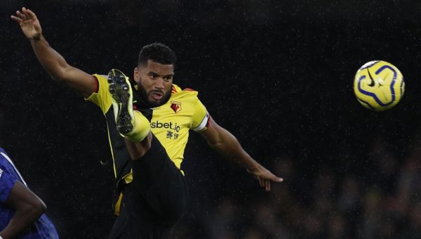 In this file photo taken on November 02, 2019 Watford's English-born Jamaican defender Adrian Mariappa (R) controls the ball during the English Premier League football match between Watford and Chelsea at Vicarage Road Stadium in Watford, north of London. Watford defender Adrian Mariappa said news that he had tested positive on May 20, 2020, for the coronavirus COVID-19, came as a "big surprise" as he has felt no ill effects. The 33-year-old was one of three positive tests at Watford with the other two among staff members. PHOTO | AFP