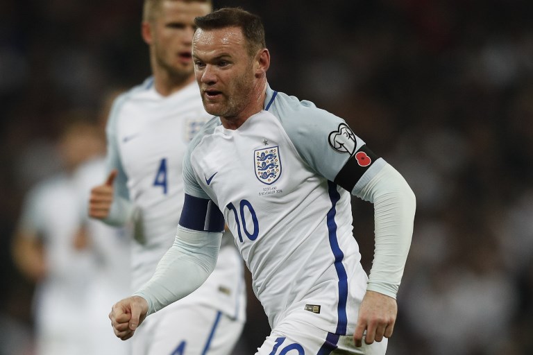 In this file photo taken on November 11, 2016 England's striker Wayne Rooney wears a poppy armband to commemorate Armistice Day as he plays during a World Cup qualification match between England and Scotland at Wembley stadium in London. Wayne Rooney is to come out of England retirement for a final one-off appearance against the United States in an international friendly at Wembley this month, the Football Association announced Sunday, November 4, 2018. PHOTO/AFP