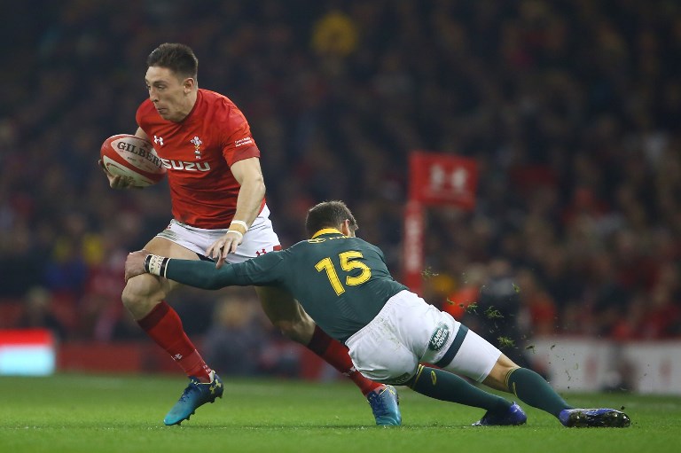 In this file photo taken on November 24, 2018 Wales' wing Josh Adams (L) is tackled by South Africa's full-back Willie le Roux during the autumn international rugby union test match between Wales and South Africa at the Principality stadium in Cardiff, south Wales. Selected on the wing for Wales' match against France, the 23-year-old can also play at full-back. The Worcester star demonstrated his pace and fearlessness during some robust exchanges against Australia in November. PHOTO/AFP