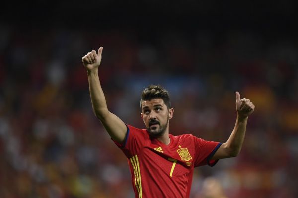 In this file photo taken on September 2, 2017 Spain's forward David Villa waves as he celebrates their victory at the end of the World Cup 2018 qualifier football match Spain vs Italy at the Santiago Bernabeu stadium in Madrid. Star striker Villa, who holds the record for most international goals scored for Spain, announced on November 13, 2019 he was quitting professional football at the end of the season. PHOTO | AFP