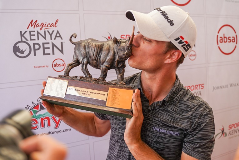 Italian Guido Migliozzi kises the Magical Kenya Open Golf Championship trophy after he was crowned champion at the tournament. PHOTO/SPN