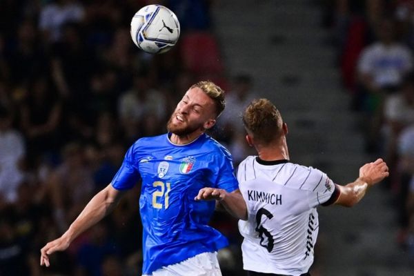Italy's midfielder Davide Frattesi (L) and Germany's midfielder Joshua Kimmich go for a header during the UEFA Nations League - League A, Group 3 first leg football match between Italy and Germany on June 4, 2022 at the Renato Dall'Ara stadium in Bologna. PHOTO | AFP